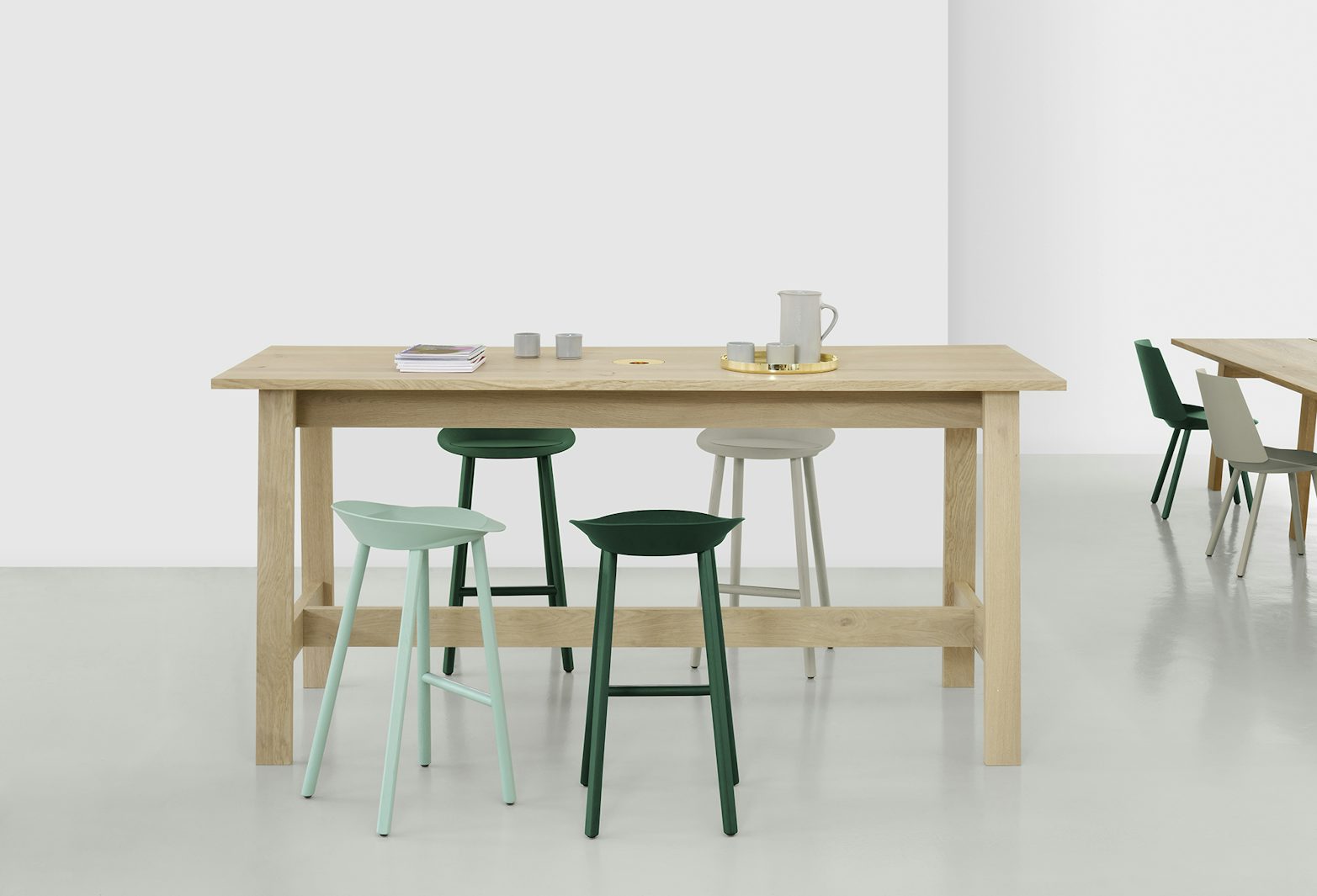 wide shot of e15 basis high table with jean stools