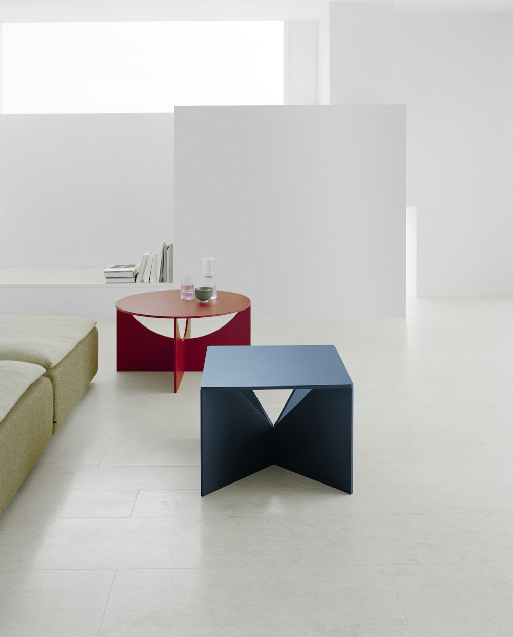 calvert coffee table in navy with charlotte coffee table in neon red by e15 furniture