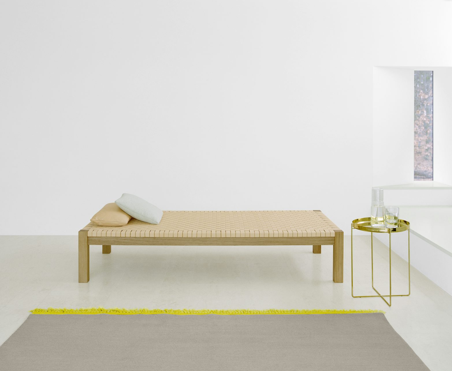 e15 theban daybed in natural leather with habibi side table in brass